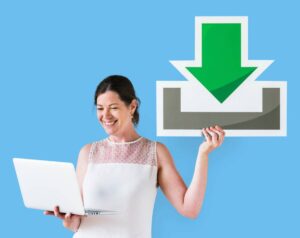 Woman smiling, holding laptop and touching a large download icon against a blue background.